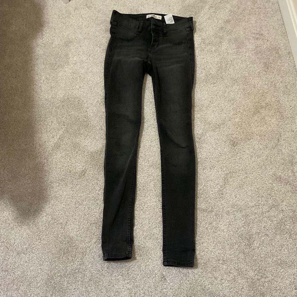 Hollister black super skinny jeans, low rise three button size 1/w 25